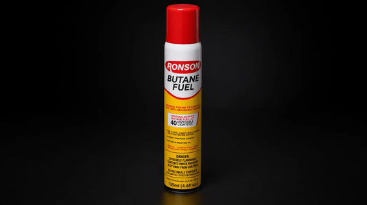 G & J's Finest butane fuel for torch lighters, shown in a clear container ready for refill or use with precision.