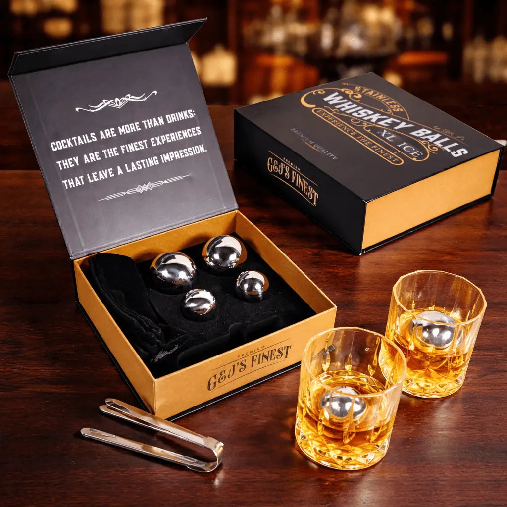 Whiskey balls set with glasses and packaging on a wooden surface
