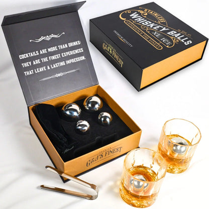 G & J's Finest premium whiskey ball gift set with four whiskey balls, a pouch, and tongs, displayed on a wooden surface.