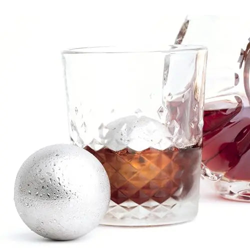 Large 55mm stainless steel whiskey balls from G & J's Finest, shown in a close-up image highlighting the polished metal surface.